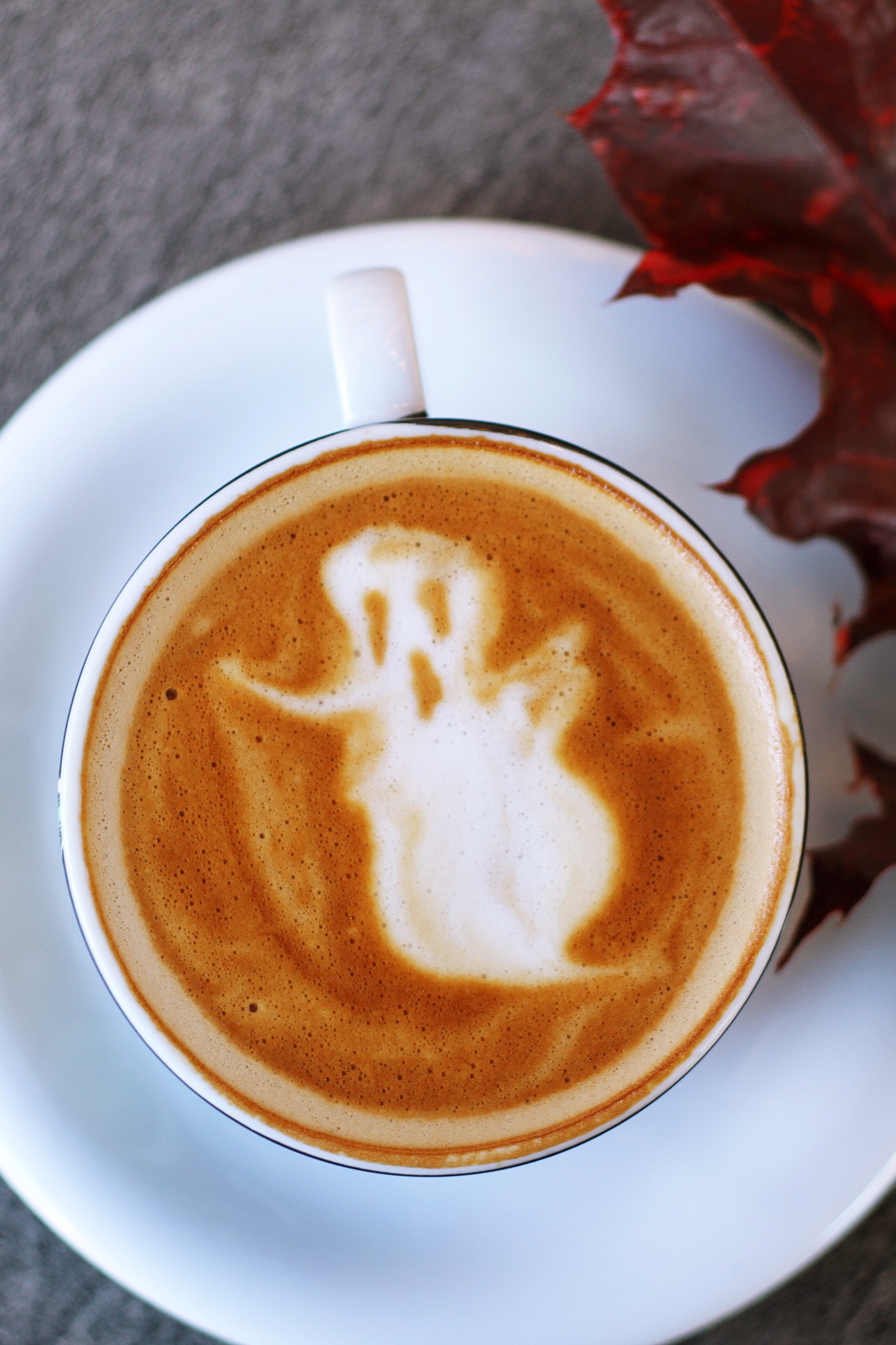 Coffee with ghost design in the froth