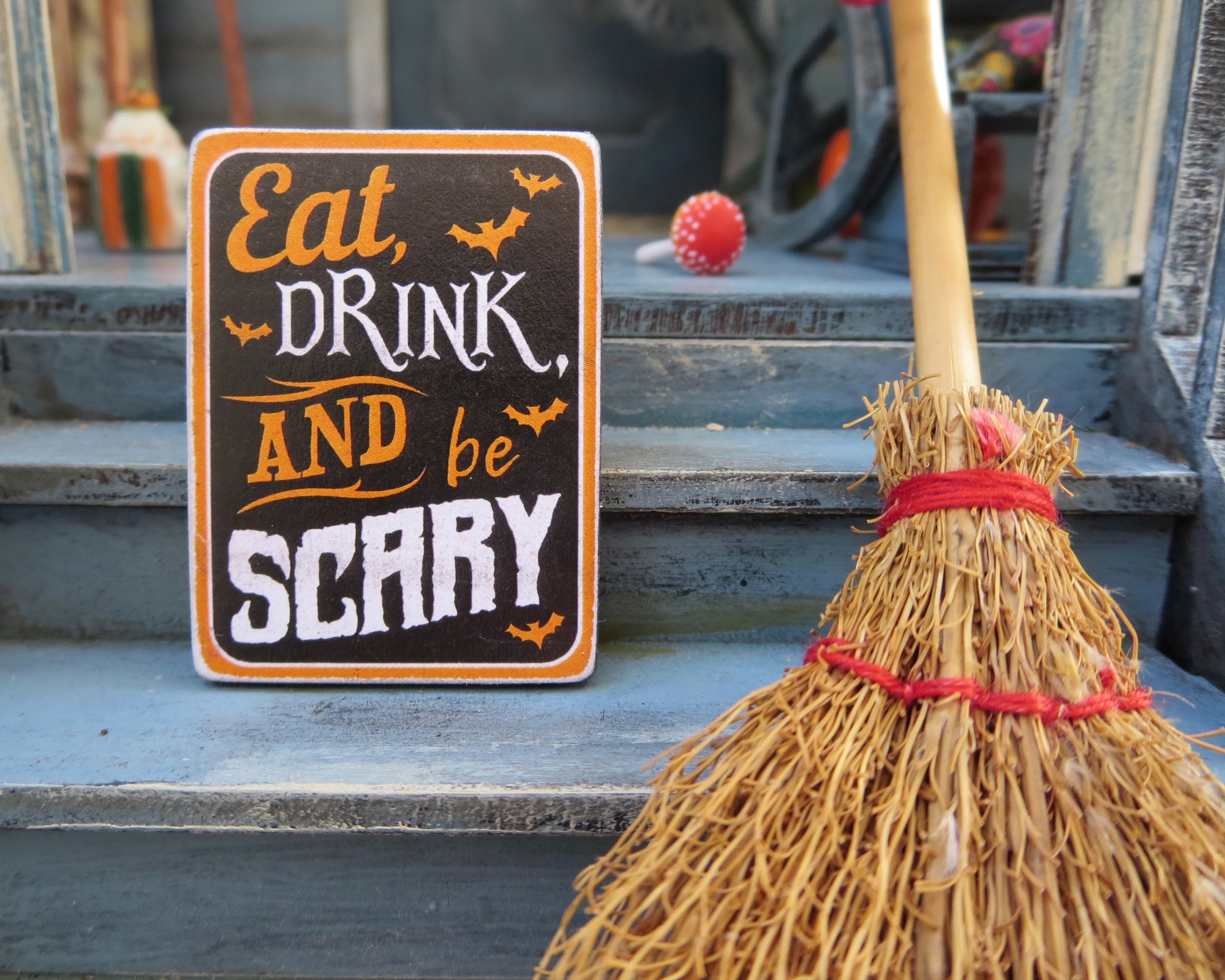 a sign that says 'eat drink and be scary'